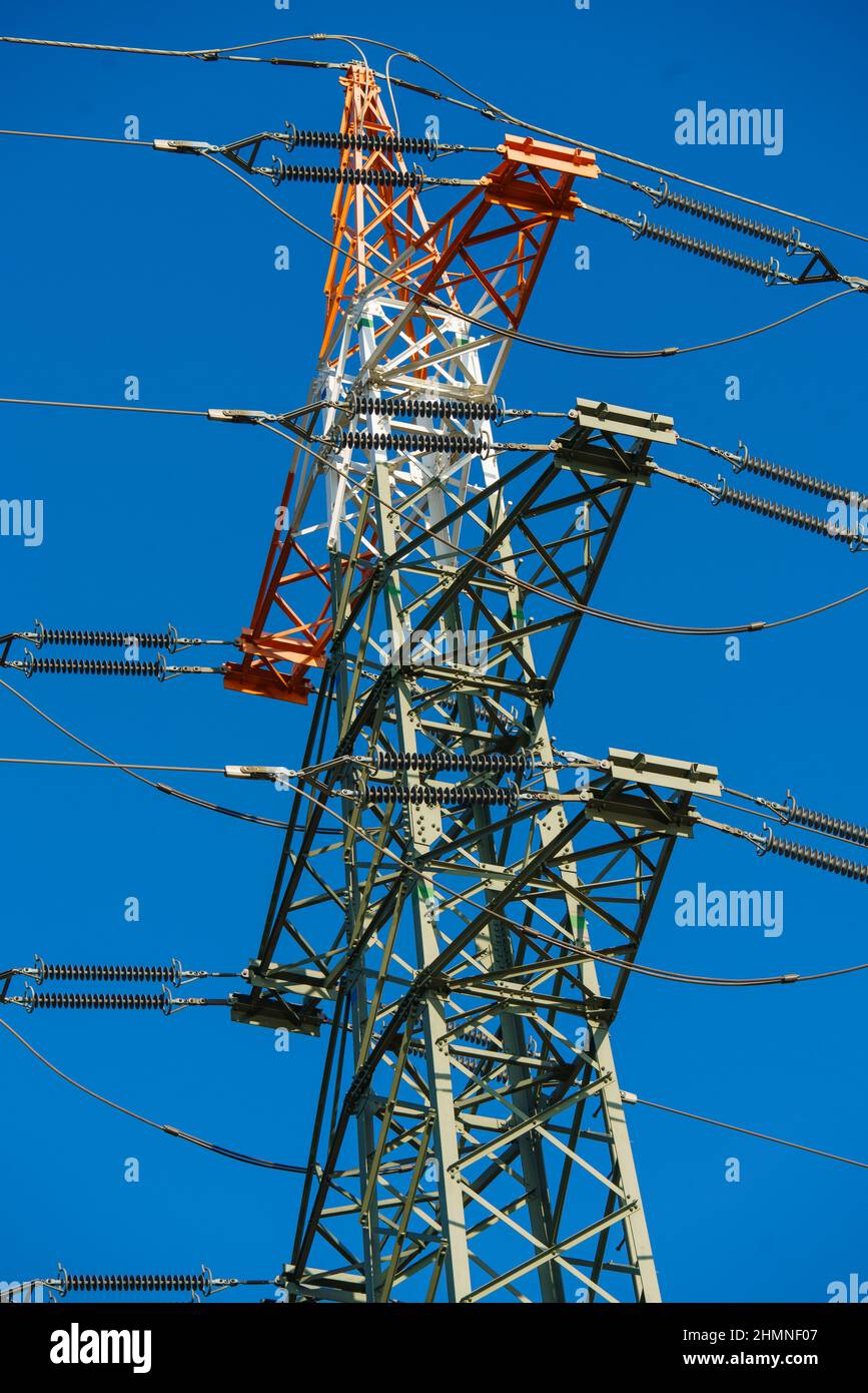 High voltage tower with electricity transmission power lines against ...