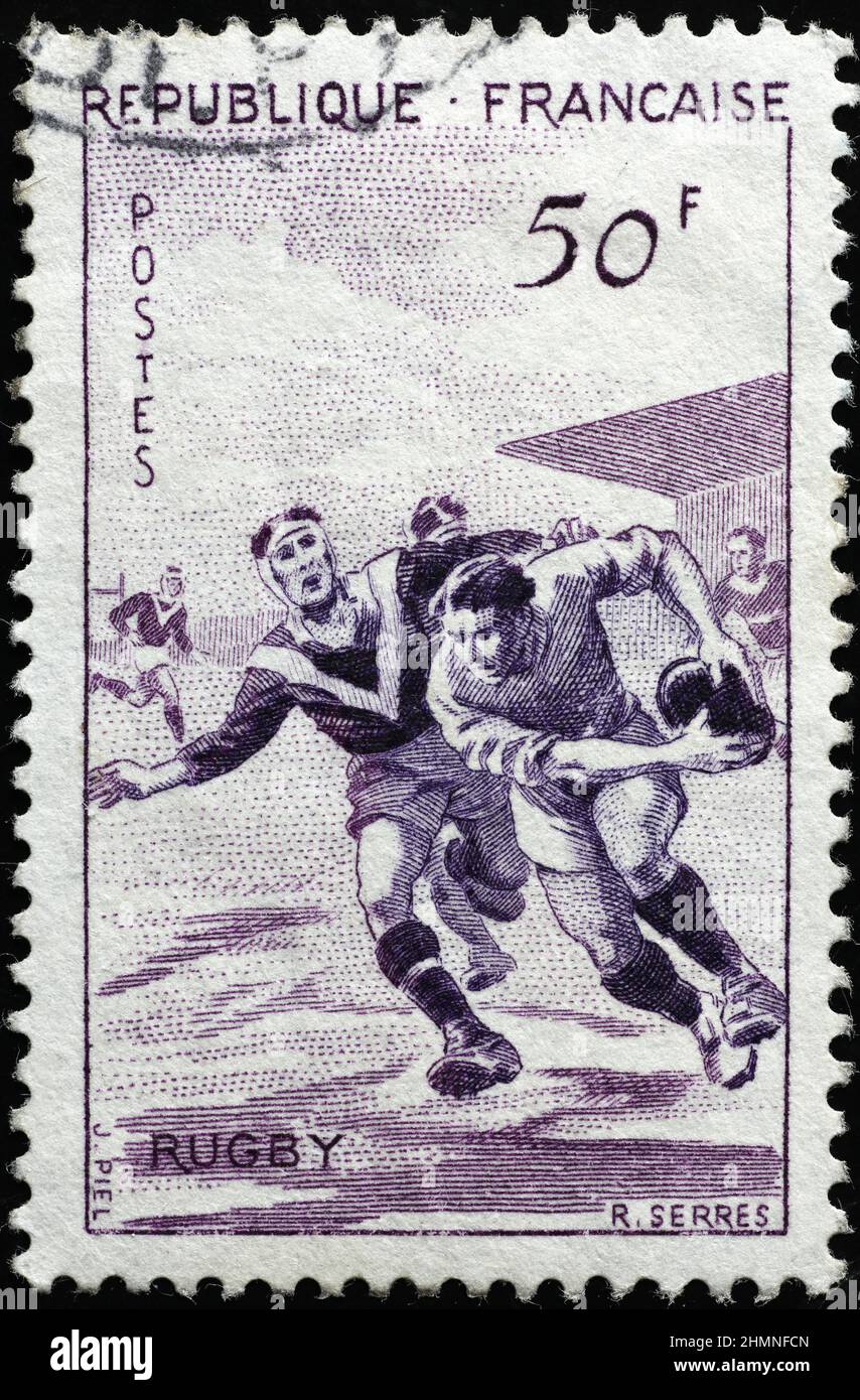 Rugby players on vintage french stamp Stock Photo