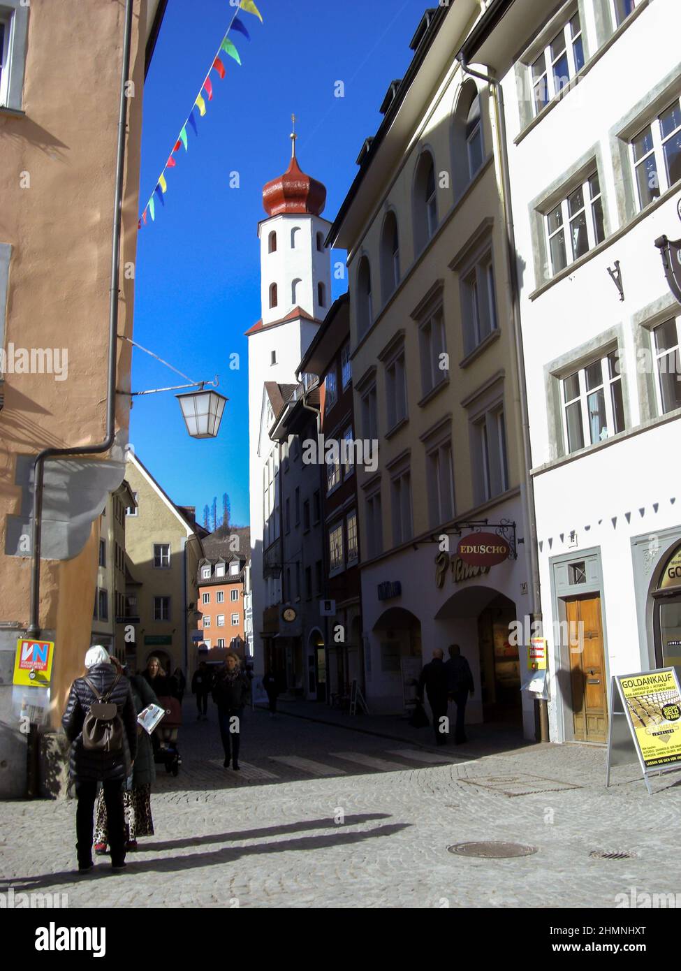 Feldkirch, Austria, February 26, 2019 People are discovering the old town on a sunny day Stock Photo