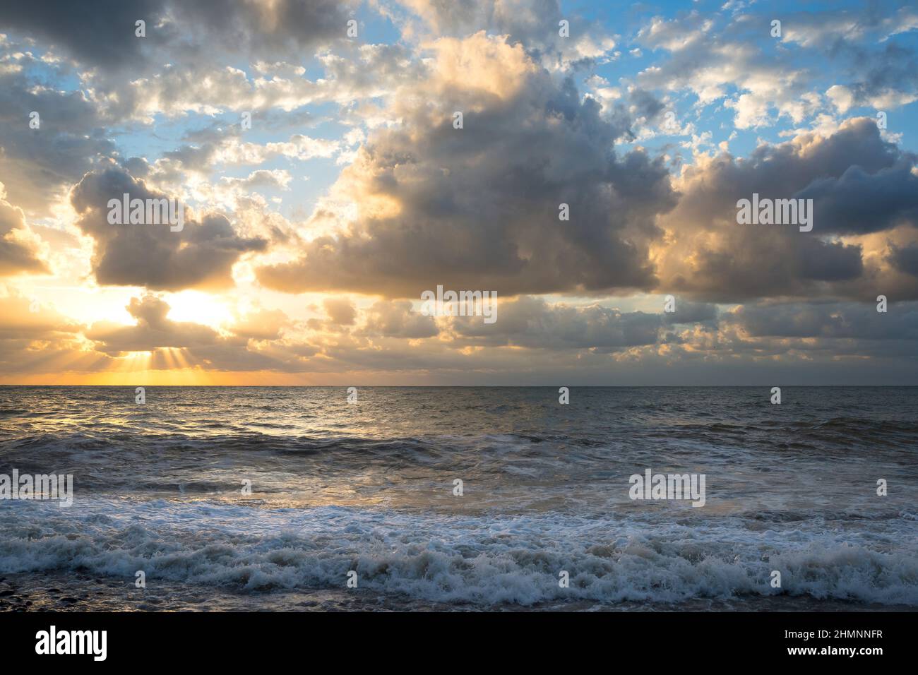 The beautiful sea with clouds on a sunset Stock Photo - Alamy