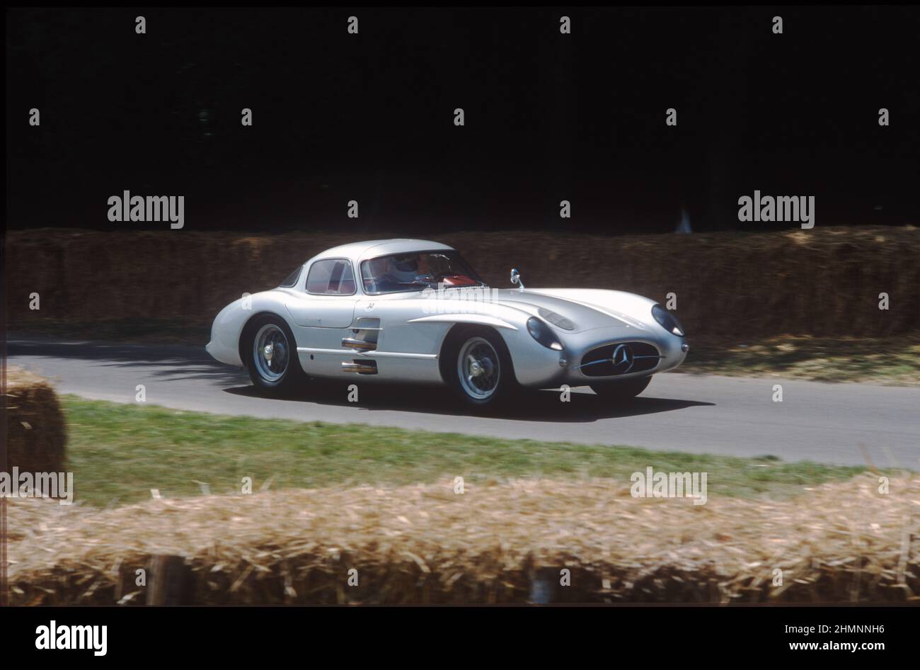 One of only tw0 1955 Mercedes 300 SLR Coupes - this the one with the red interior - in action at the 2003 Goodwood Festival of Speed. Stock Photo