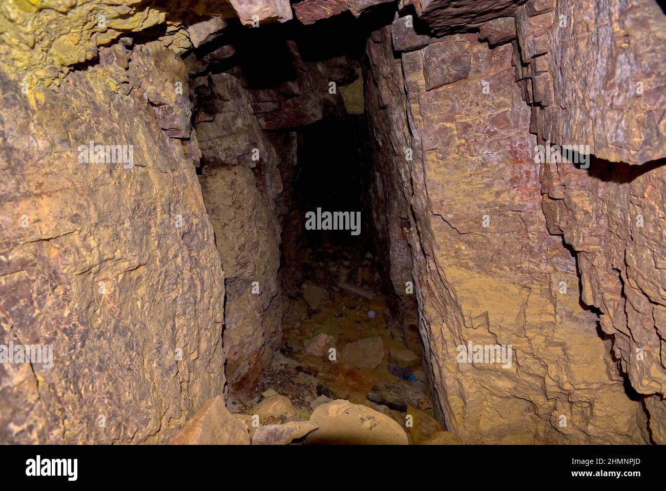 Abandoned to the Darkness. An abandoned mineshaft in the side of Sullivan Butte in Chino Valley AZ. For safety reasons I did not fully explore the min Stock Photo