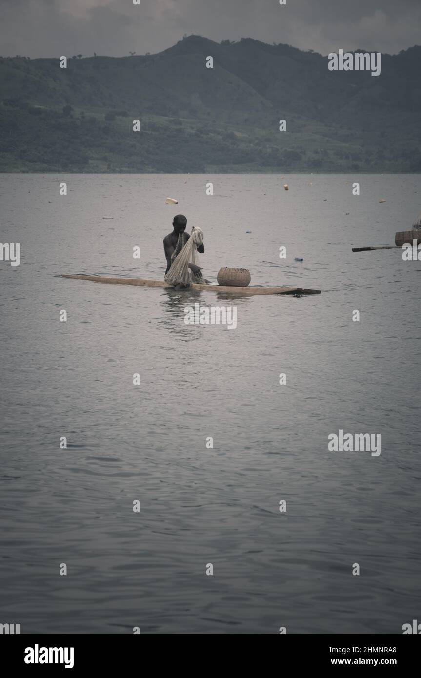 A man fishing on a lake Stock Photo