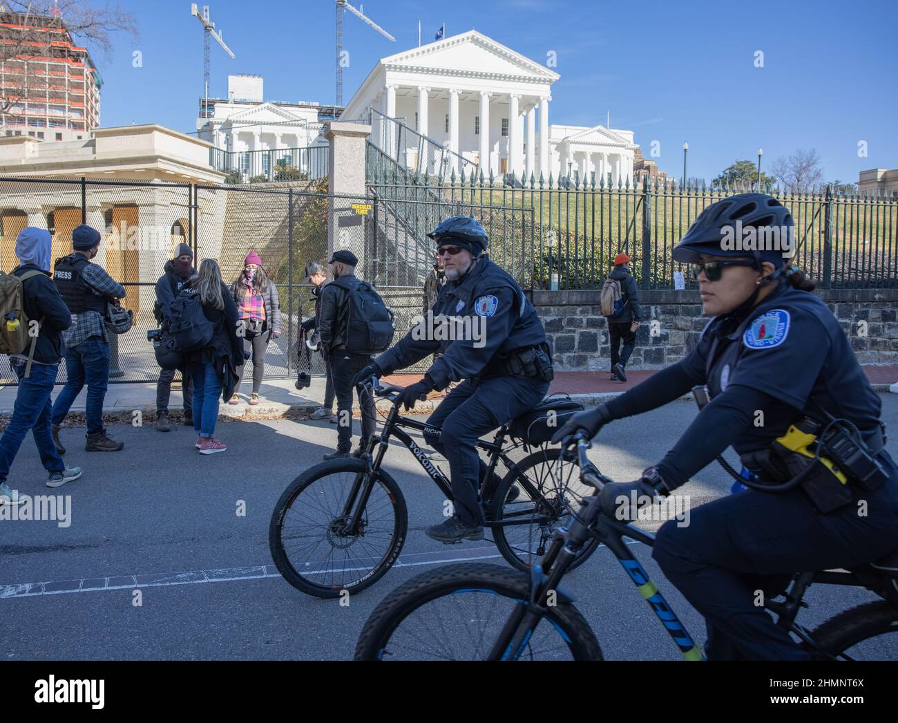 RICHMOND, VA – January 17, 2021: Police officers and others are seen near the Virginia State Capitol in Richmond. Stock Photo