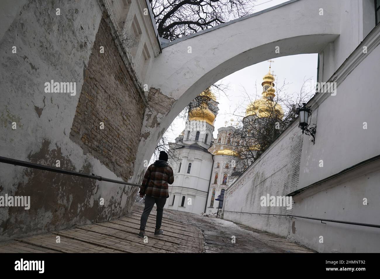 Kiev, Ukraine. 11th Feb, 2022. A man walks through Kiev Pechersk Lavra, a  Church and monastery complex in Kiev on February 11, 2022 in Ukraine. The  capital remains calm as Russia conducts