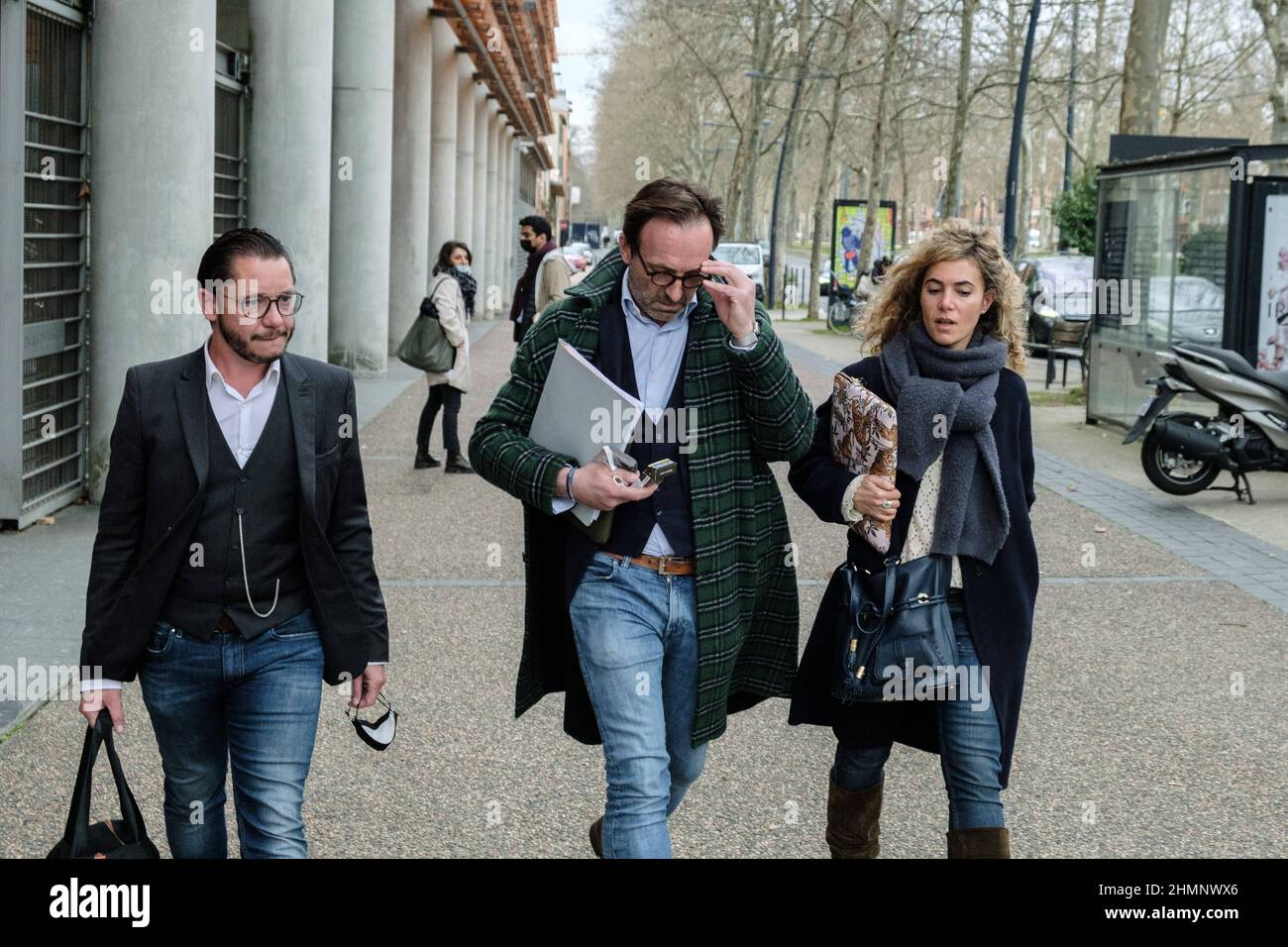 French lawyers for Cedric Jubillar, Alexandre Martin (green coat),  Jean-Baptiste Alary and Emmanuelle Franck leaving Toulouse's courthouse,  southern France on February 11, 2022. The husband of Delphine Jubillar, a  33-year-old nurse who