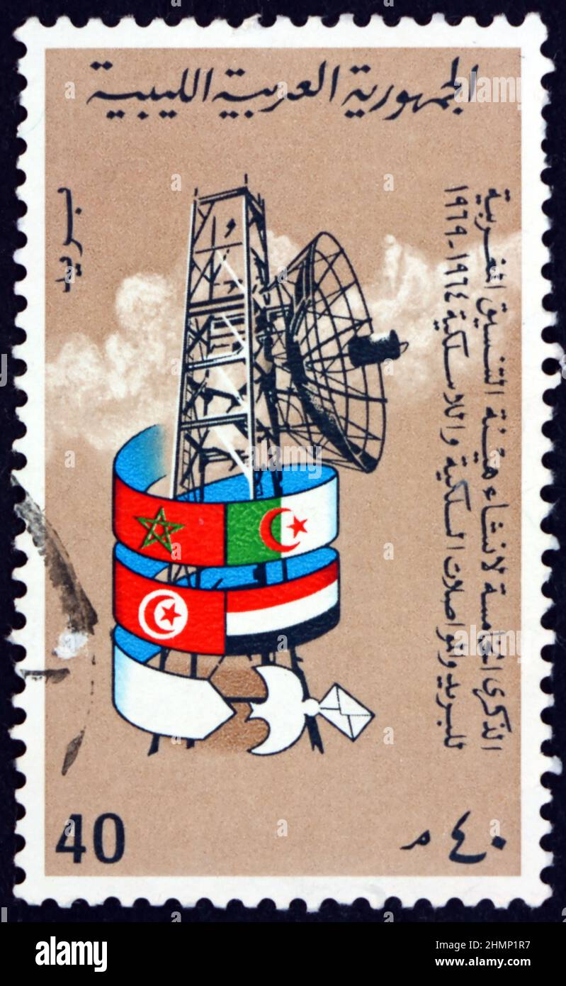 LIBYA - CIRCA 1969: a stamp printed in Libya shows Radar, Flags and Carrier Pigeon, circa 1969 Stock Photo