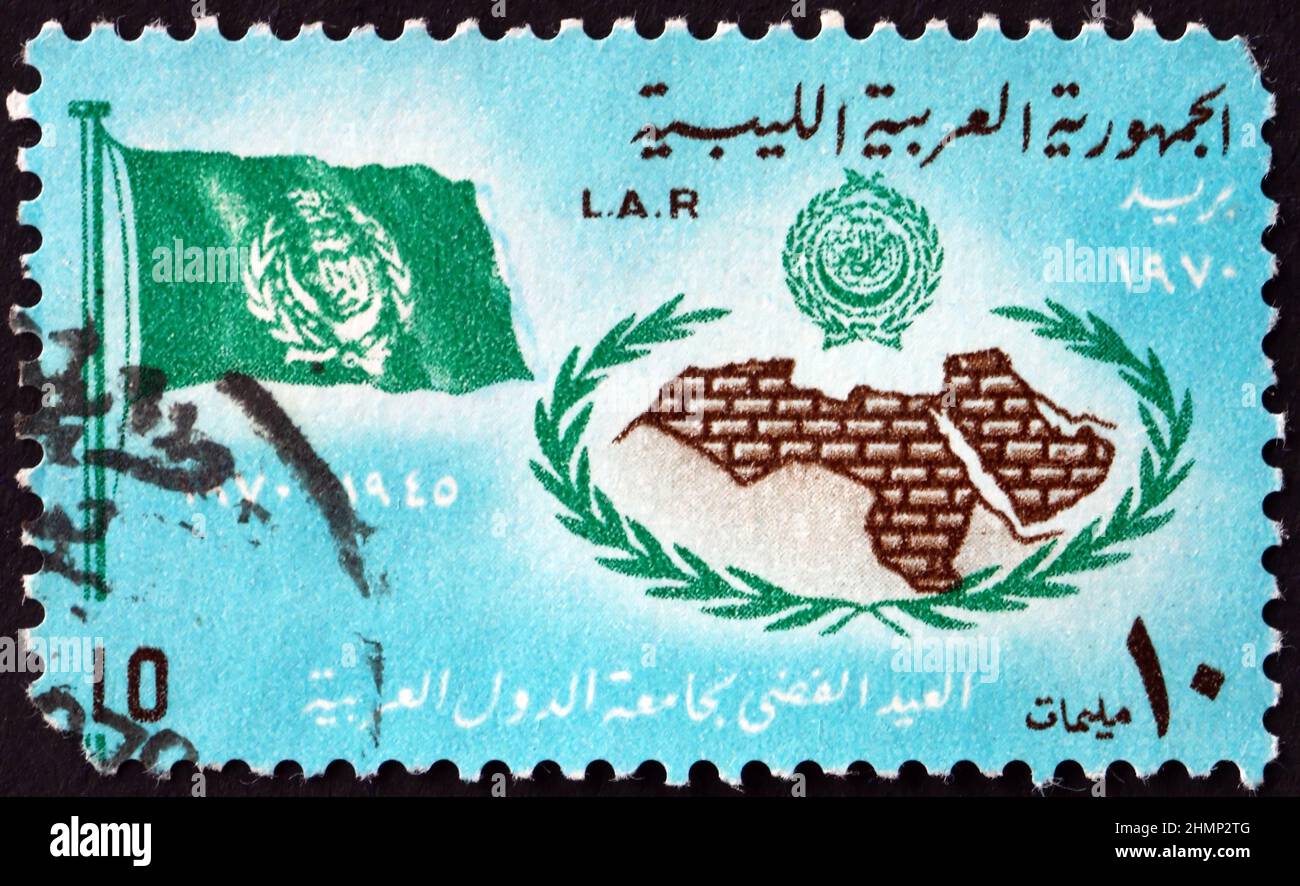 LIBYA - CIRCA 1970: a stamp printed in Libya shows Map of Arab League Countries, Flag and Emblem, circa 1970 Stock Photo