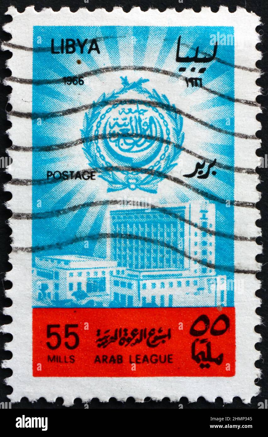 LIBYA - CIRCA 1966: a stamp printed in Libya shows Arab League Center, Cairo, and Emblem, circa 1966 Stock Photo