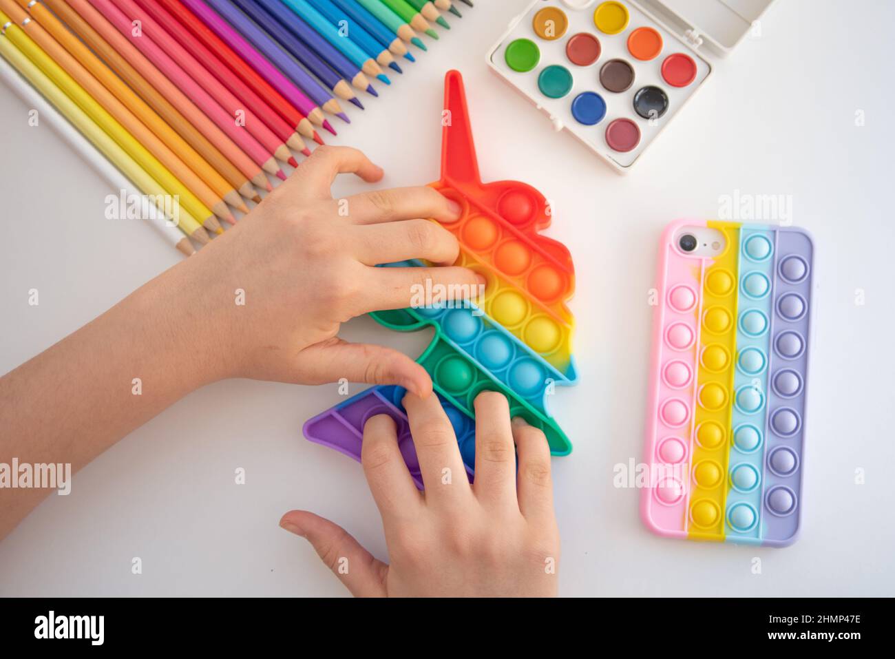 Rainbow colored child toys Stock Photo Alamy