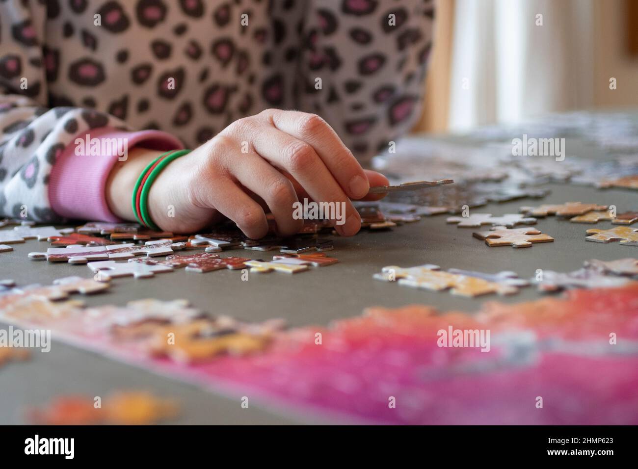 Child putting puzzle together Stock Photo Alamy