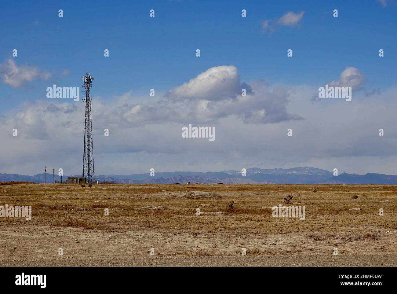 tall radio tower in a desert landscape Stock Photo