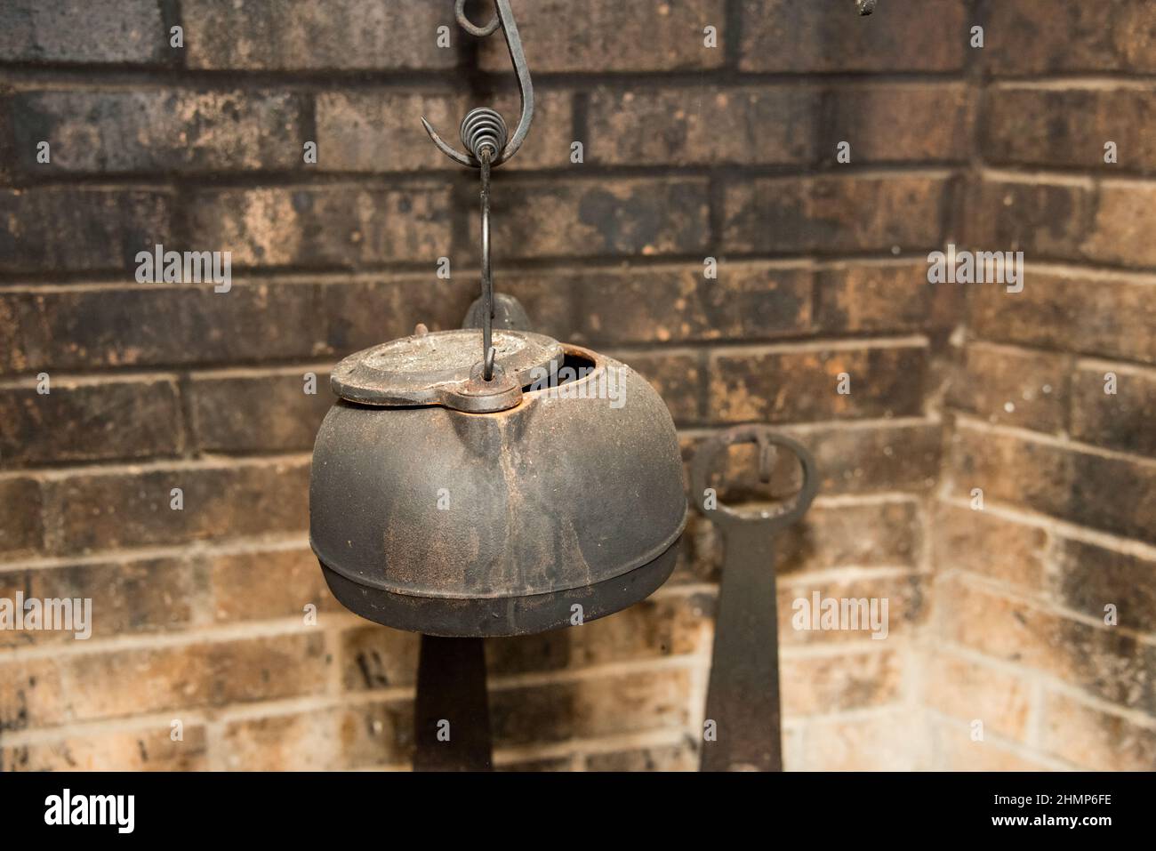 Cast iron cookware on colonial hearth Stock Photo