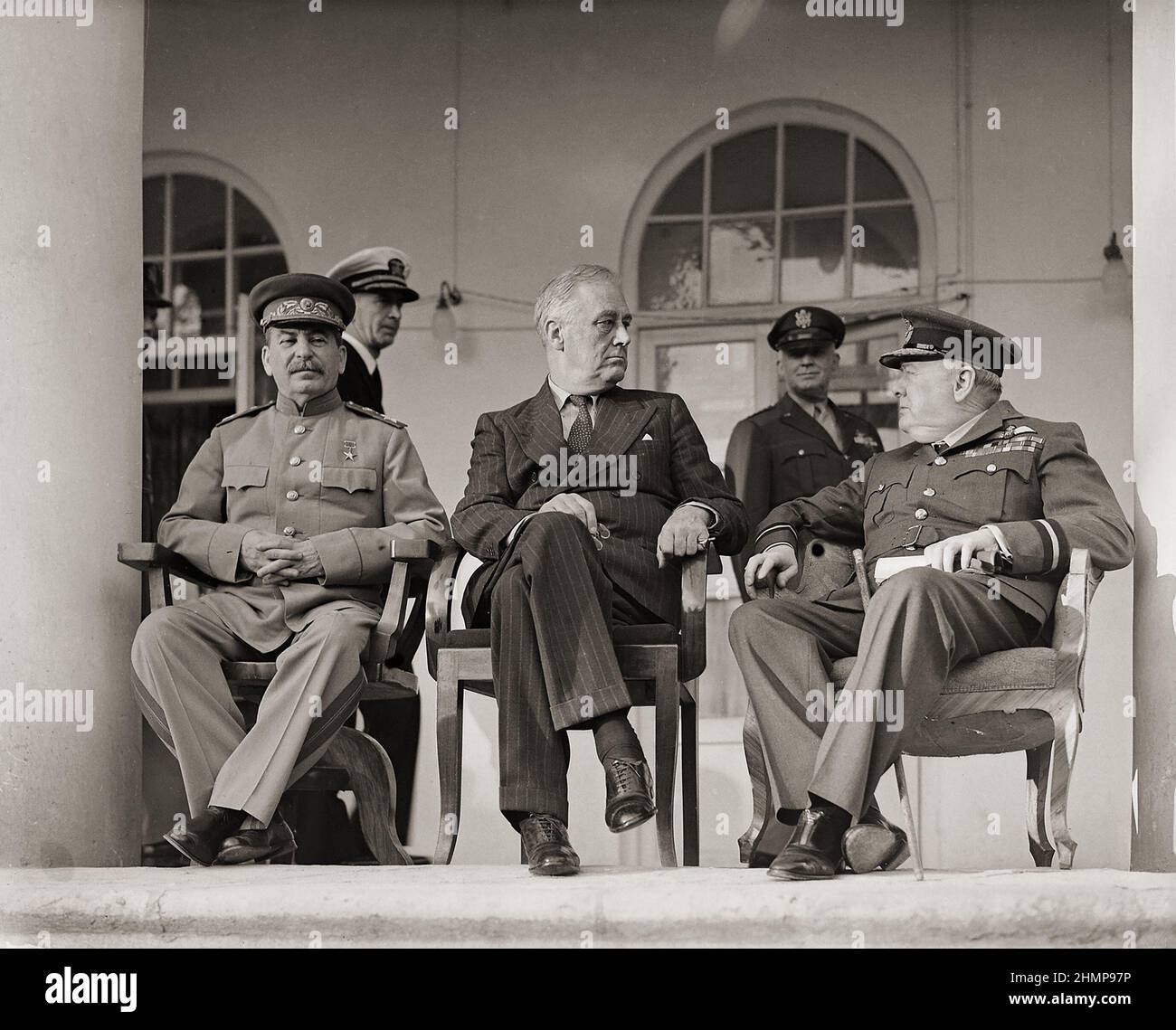 Joseph Stalin, Franklin D. Roosevelt and Winston Churchill on the veranda of the Soviet Legation in Teheran, during the first “Big Three” Conference. Stock Photo