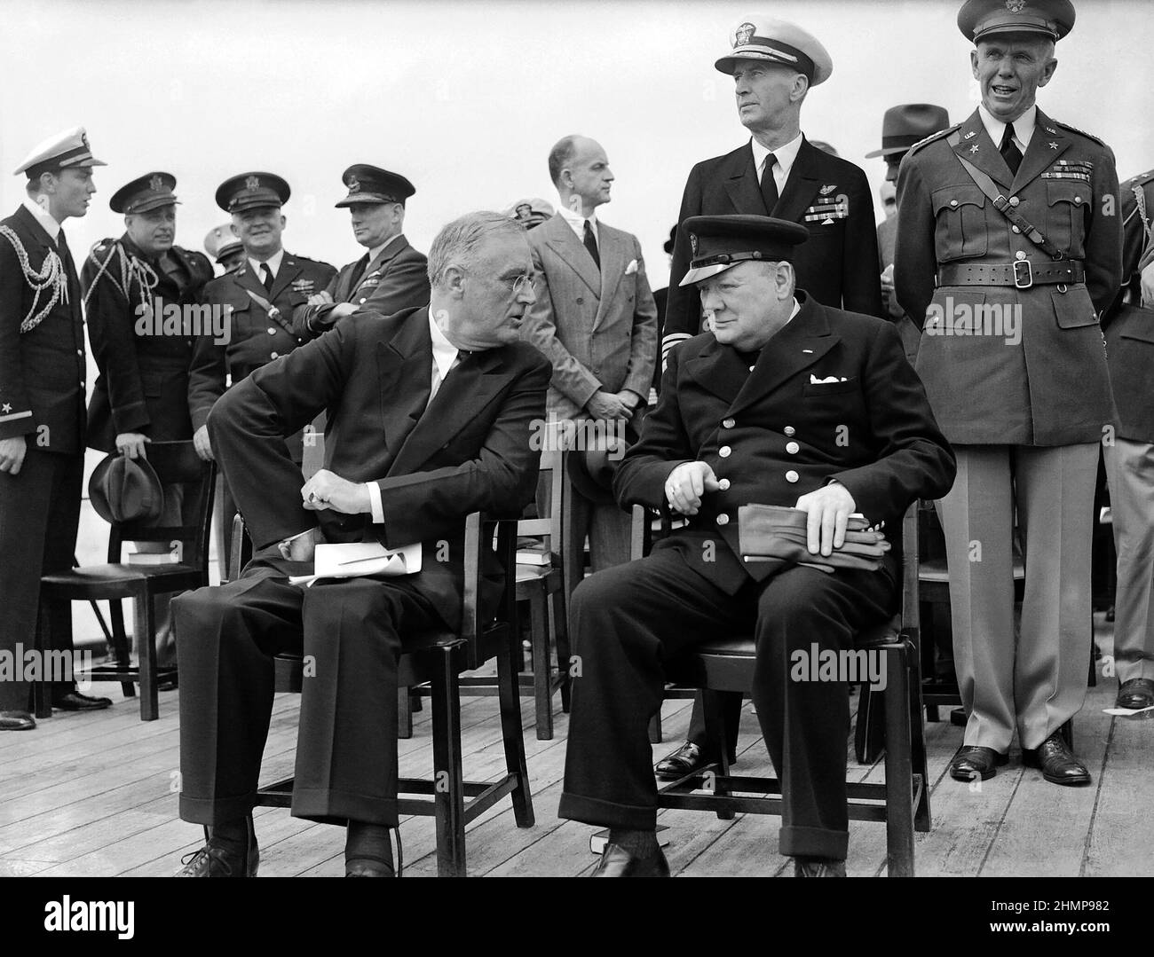 President Roosevelt and Winston Churchill seated on the quarterdeck of HMS PRINCE OF WALES for a Sunday service during the Atlantic Conference, 1941. Stock Photo