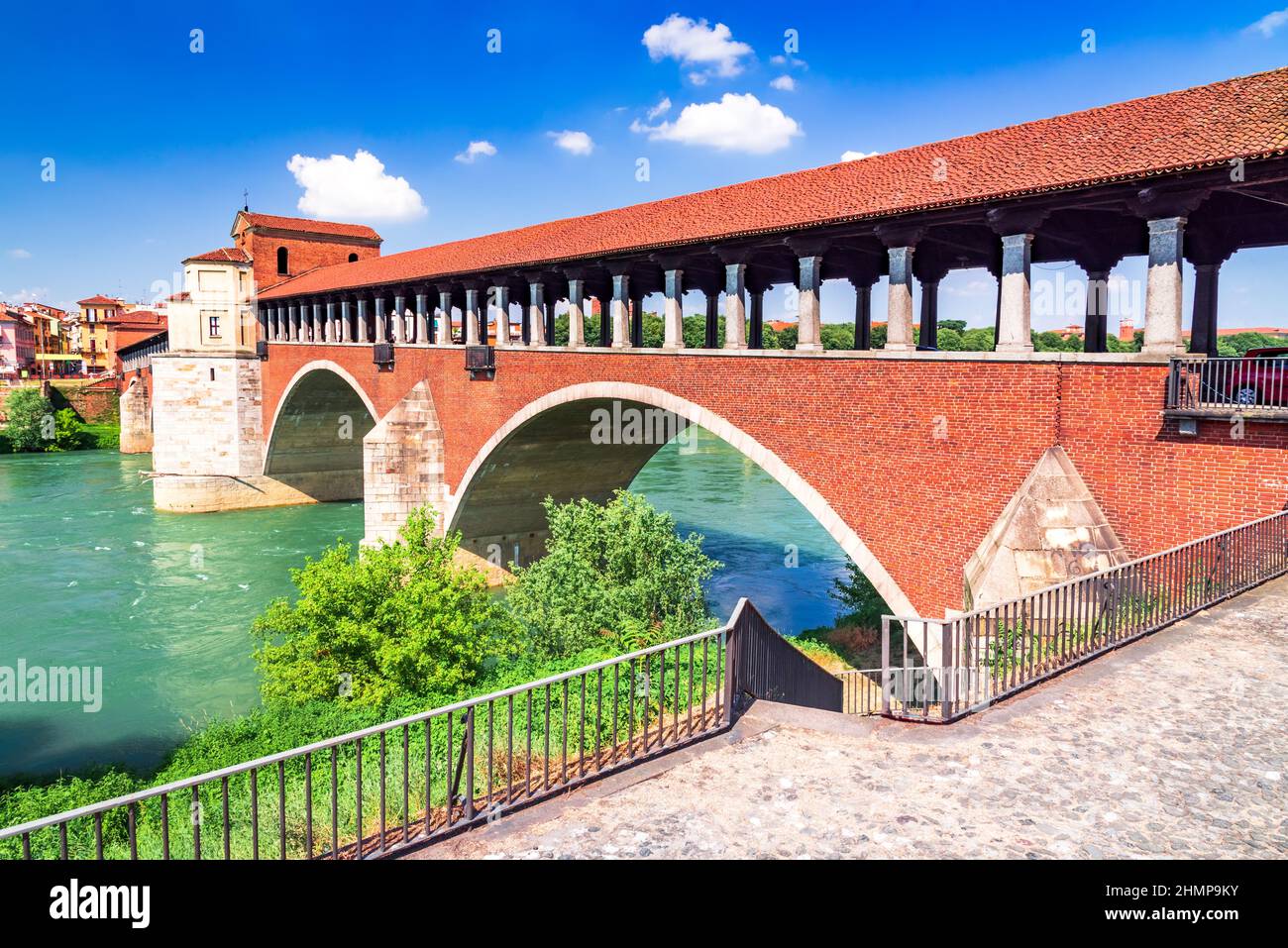 Pavia, Italy. Ponte Coperto (covered bridge) or the Ponte Vecchio a stone arch bridge over the Ticino River. Stock Photo