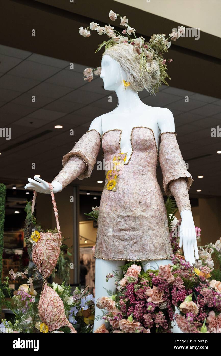 Mannequin wearing floral fashion design by Fleurs de Villes at the Northwest Flower and Garden show in Seattle, Washington. Stock Photo