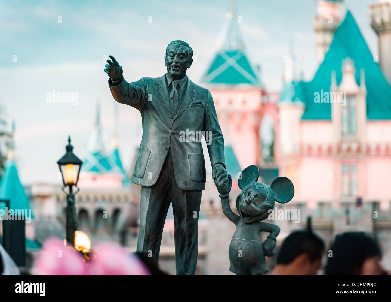 Anaheim, United States of America - October 23, 2016: monument of Walt Disney and Mickey Mouse in Disneyland and sleeping beauty castle in background Stock Photo