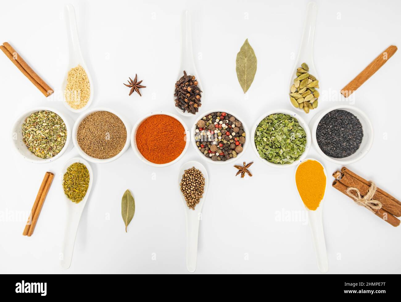 Seasonings for food. Set of different culinary spices in white ceramic