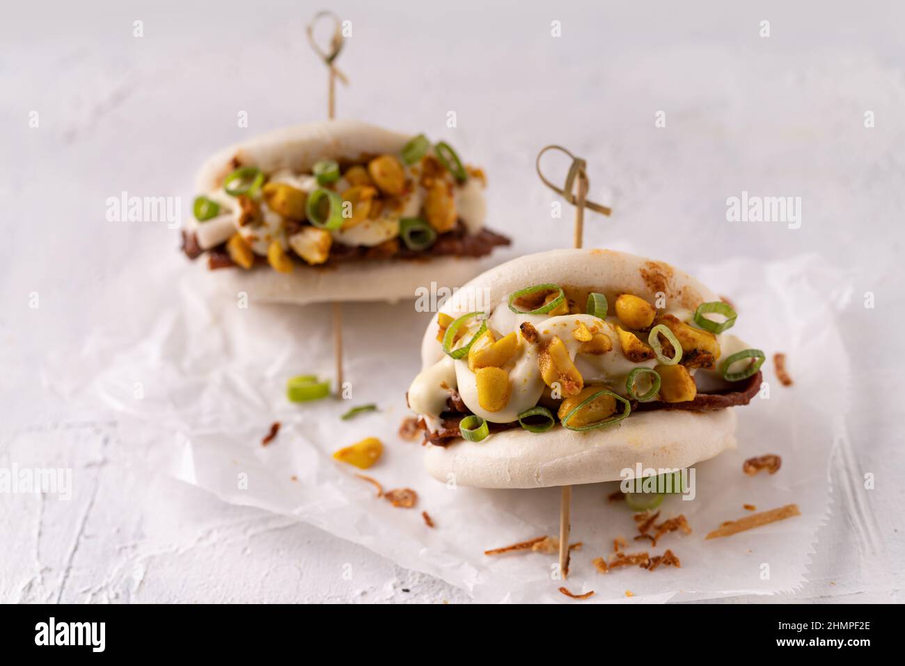 Asian fusion vegan white soft bao buns with meat alternative, mayo and