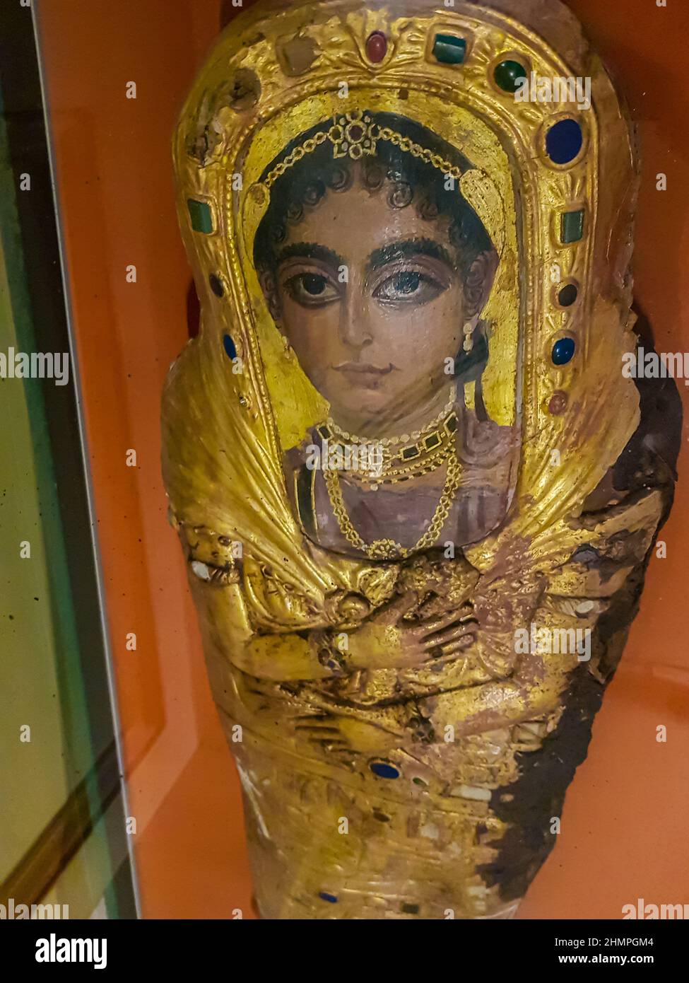 Cairo, Egypt - December 17, 2021: Female golden mummy case from Egyptian Museum in Cairo, Egypt. It is founded at 1902 and have more than 120.000 anci Stock Photo