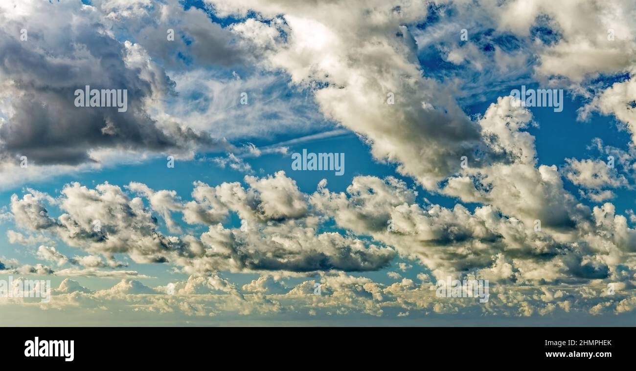 Dramatic colorful sunset sky Background with clouds and sunlight . Soft focus. Stock Photo