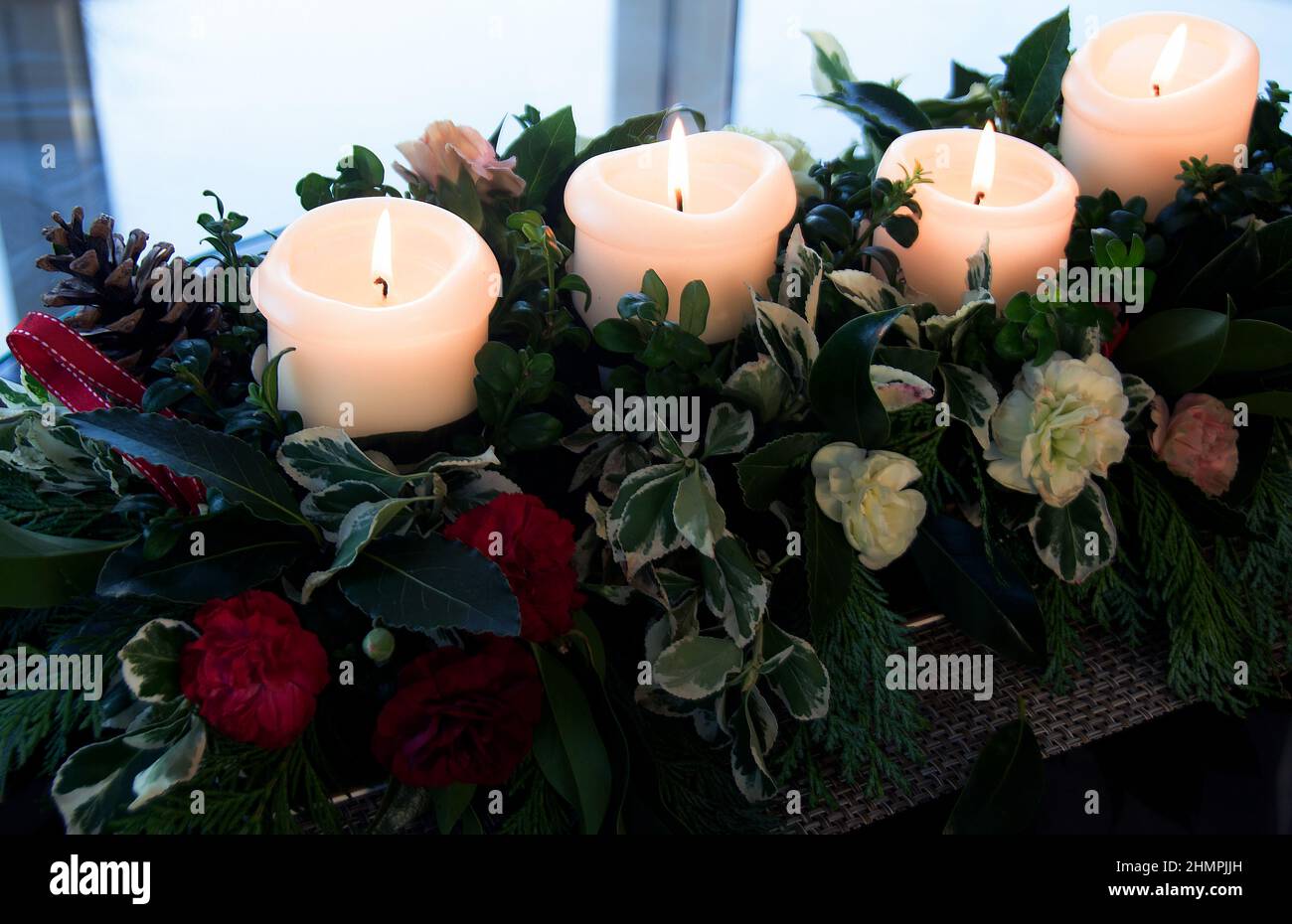 Advent wreath with lit candles Stock Photo