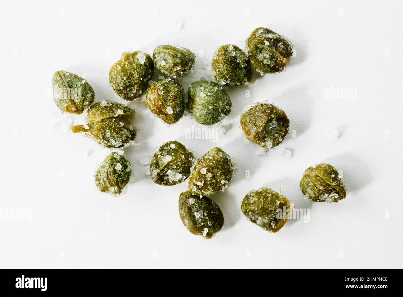 Beautiful green salted capers on white background , Stock Photo