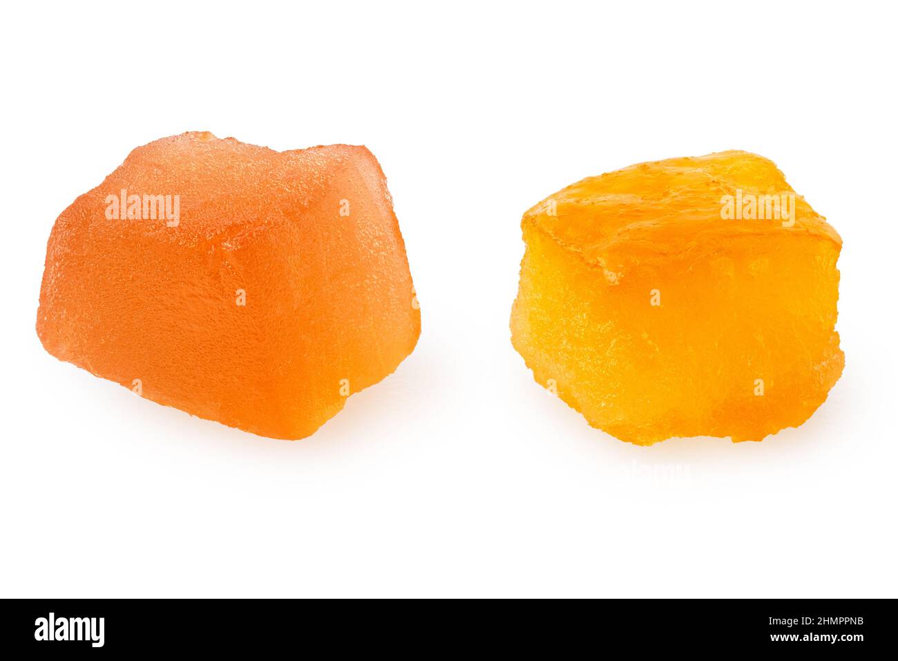 Two pieces of glazed dried fruit isolated on white. Stock Photo