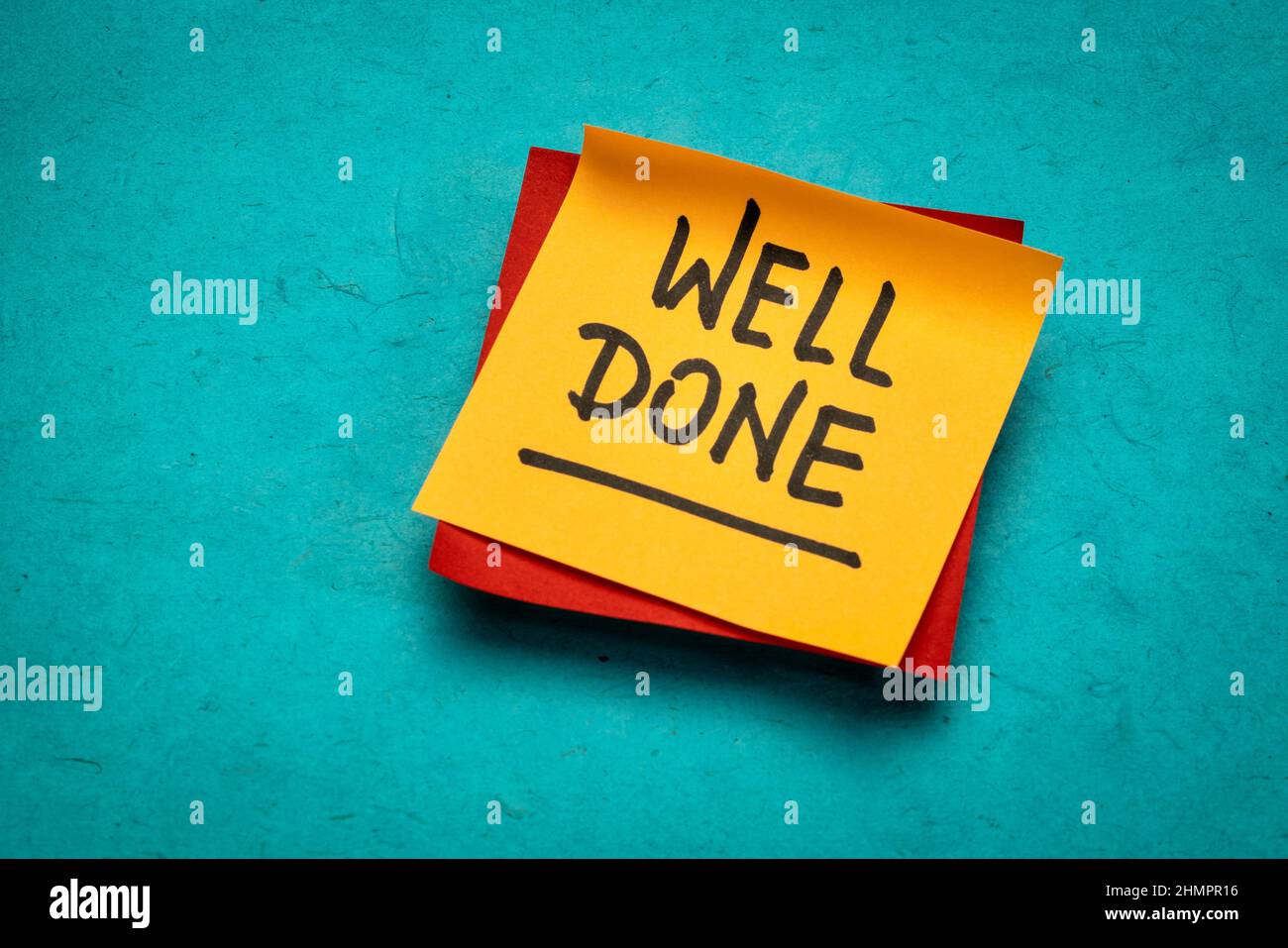 well done handwriting on reminder note, positive affirmation or congratulations concept Stock Photo