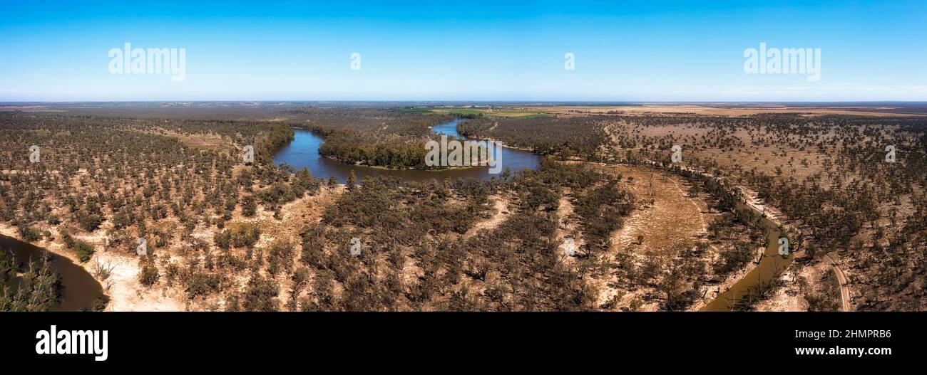 High aerial panorama of Murray river watercourse in plains of Australian riverina agriculture region on a sunny bright day. Stock Photo