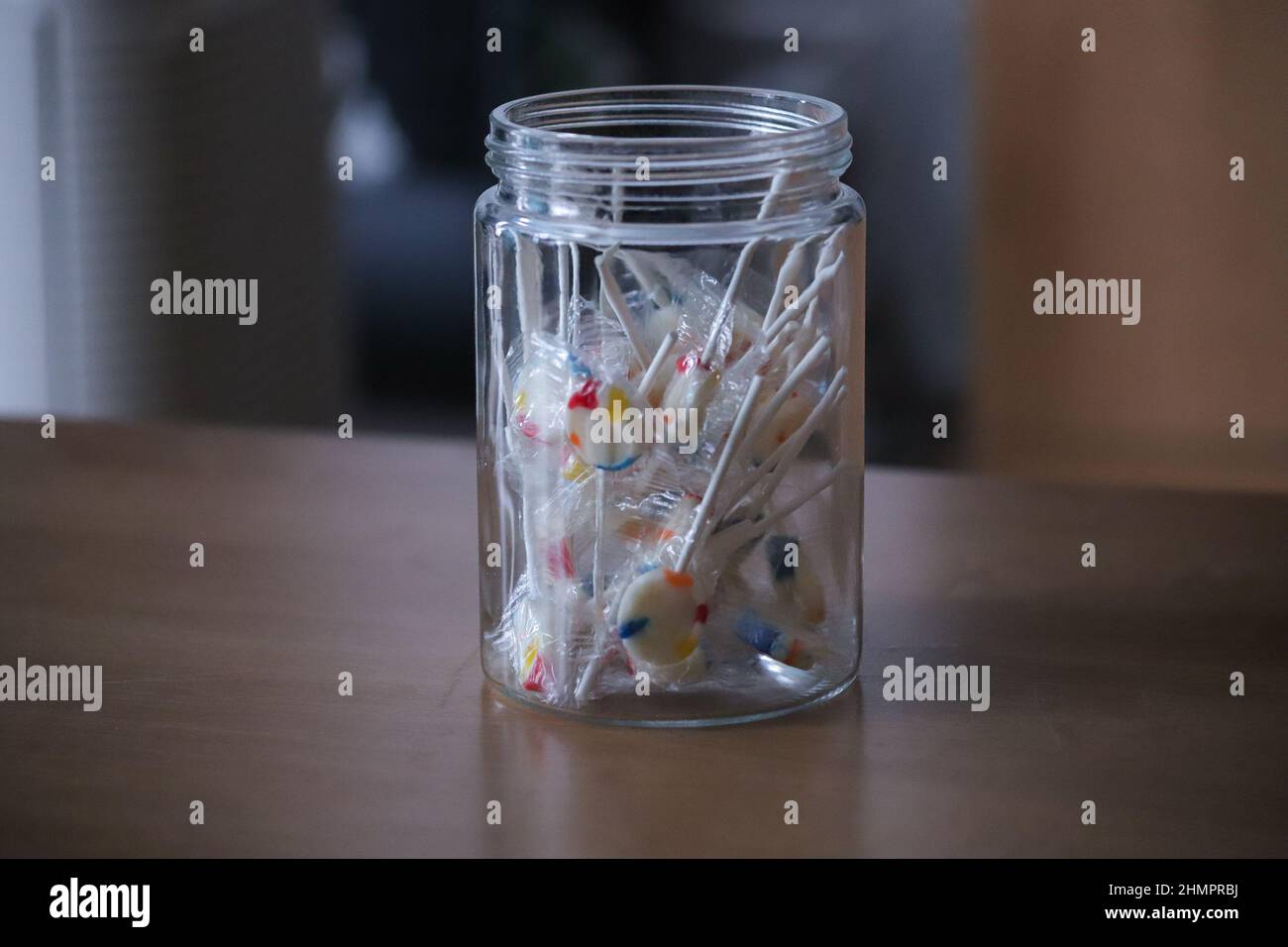 Colourful Lollipop Candy in Clear Glass Jar - Growth, Innocence, Youth and Child Protection Concepts Stock Photo