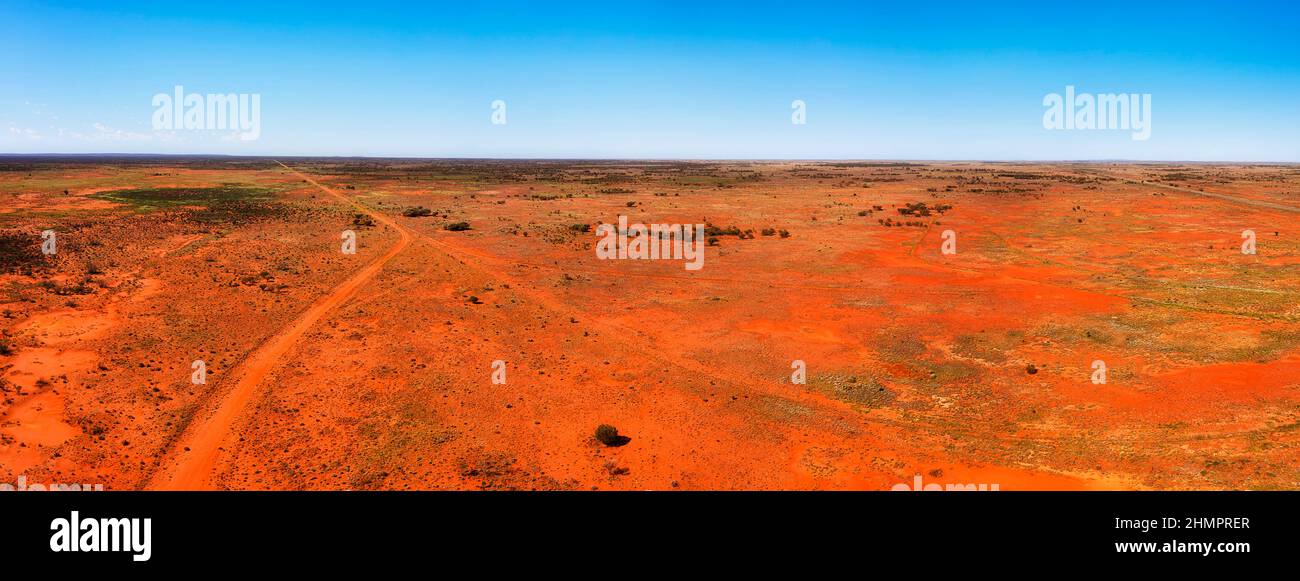 Bright red soil of australian outback at Broken hill city on Barrier highway in aerial landcape panorama. Stock Photo