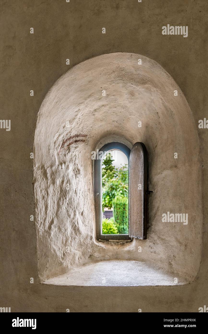 an ancient hatch through the church wall where lepers received communion, Skurup, Sweden, July 16, 2021 Stock Photo