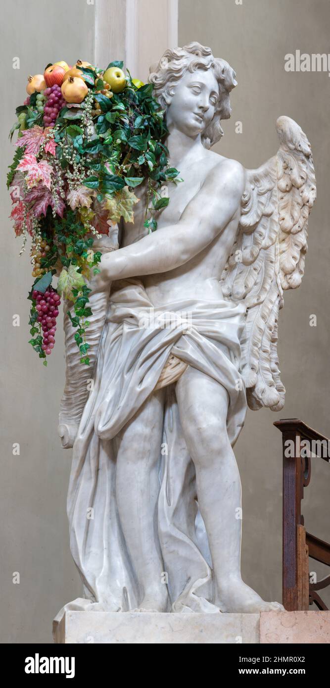 FORLÍ, ITALY - NOVEMBER 11, 2021: The baroque statue of angel with the flowers on the main altar in the church Chiesa di Santa Lucia. Stock Photo