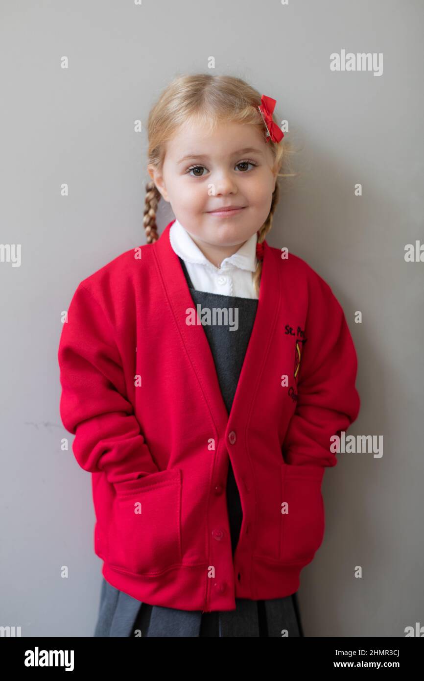3 year old British girl in her new school uniform, UK Stock Photo