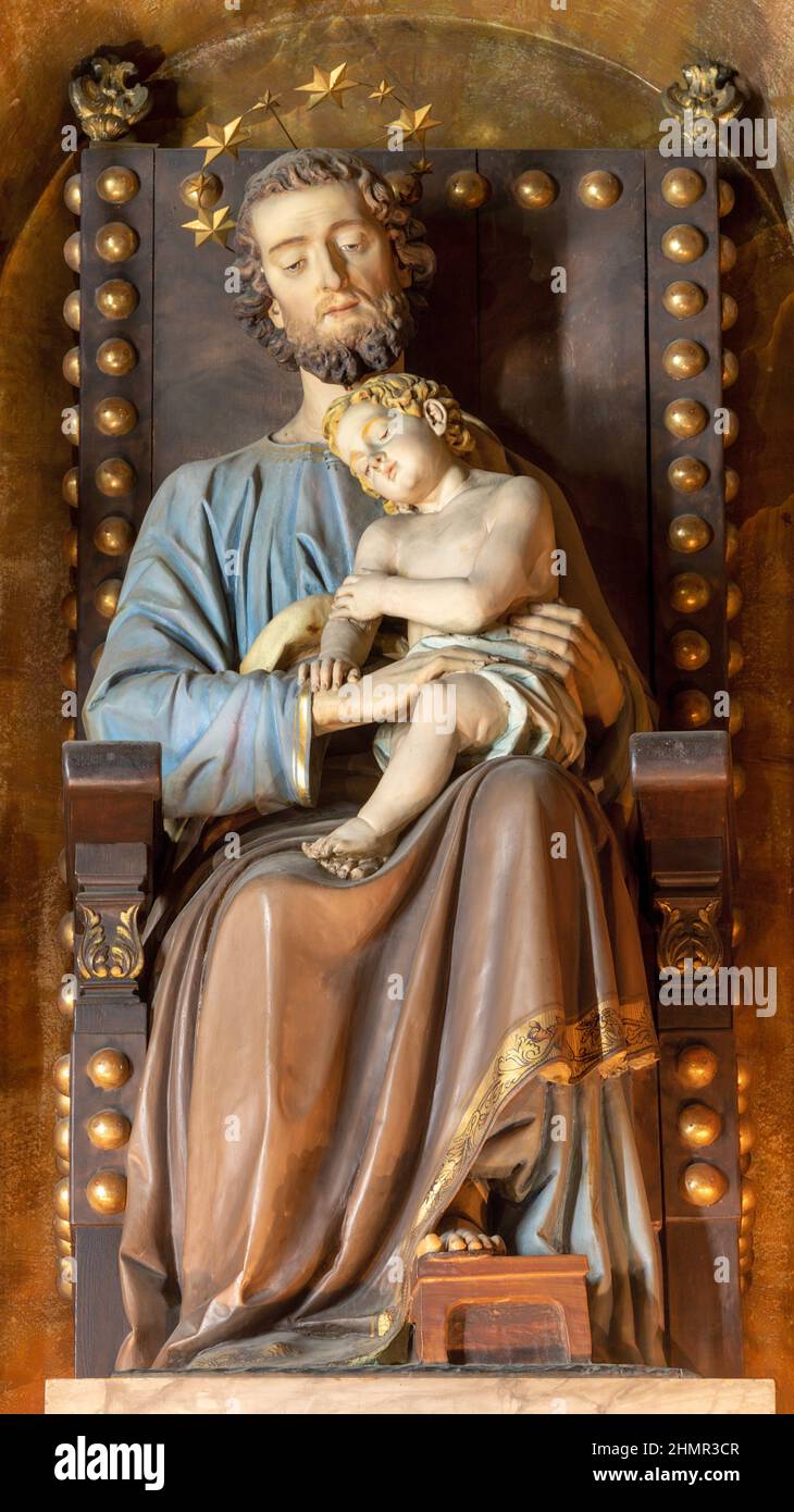 FORLÍ, ITALY - NOVEMBER 11, 2021: The carved statue of St. Joseph on the throne in the Cattedrala di Santa Croce by Emilio Righetti Stock Photo
