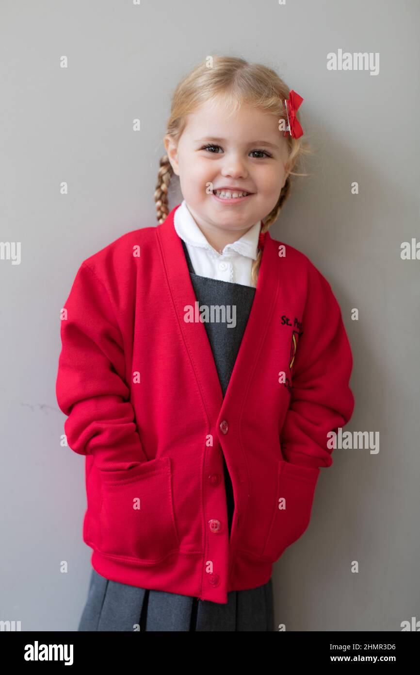 3 year old British girl in her new school uniform, UK Stock Photo