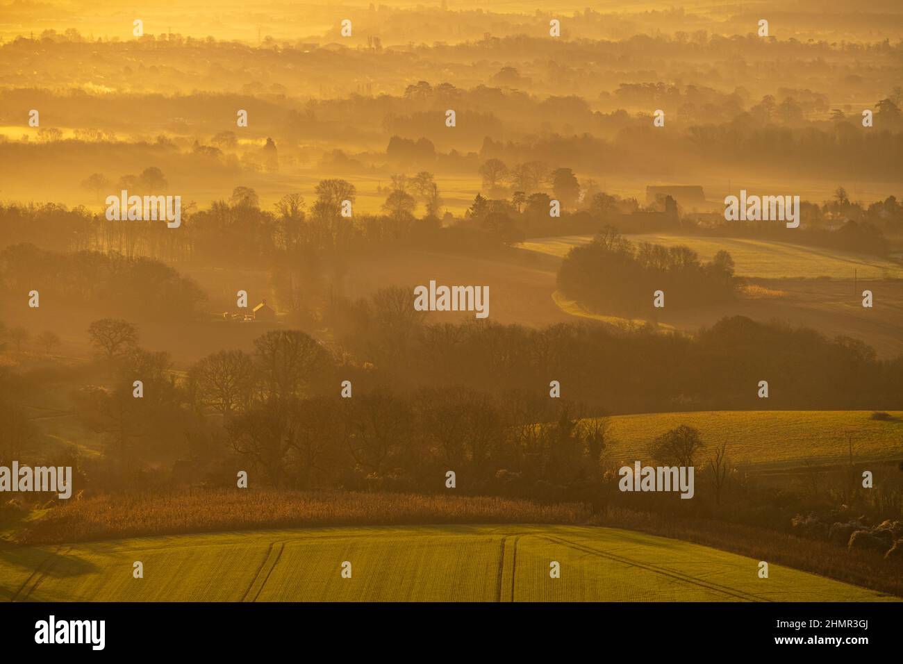 Looking down into a misty Medway valley from the North Downs above Birling and Ryarsh Kent at dawn in winter Stock Photo
