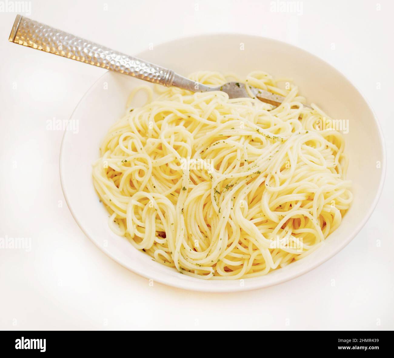 Eating Buttered Angel Hair Pasta Stock Photo Alamy