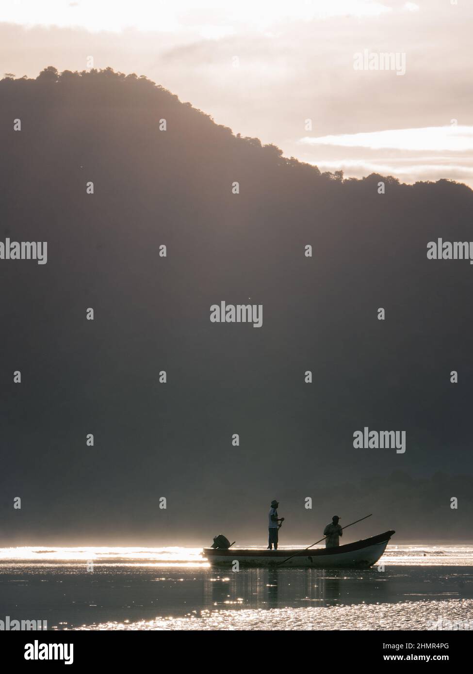 Fishermen sail on the coasts of Coqui at the Choco region in Colombia early in the morning in Coqui - Choco, Colombia on July 6, 2021. Stock Photo