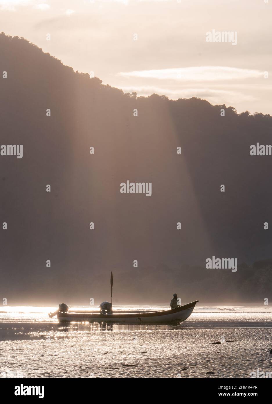 Fishermen sail on the coasts of Coqui at the Choco region in Colombia early in the morning in Coqui - Choco, Colombia on July 6, 2021. Stock Photo