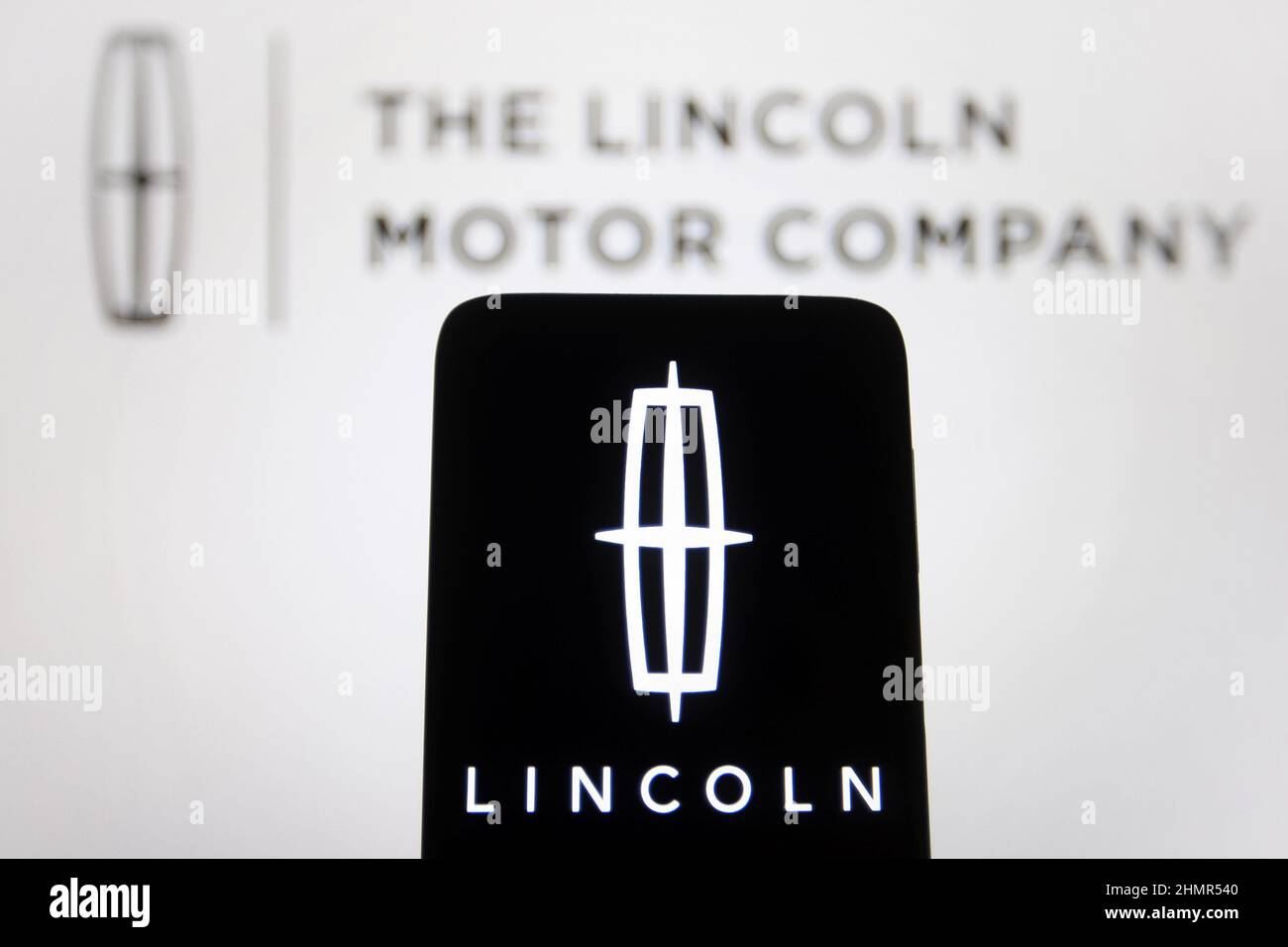 In this photo illustration, The Lincoln Motor Company logo is seen on a smartphone and a computer screen. (Photo by Pavlo Gonchar / SOPA Images/Sipa USA) Stock Photo