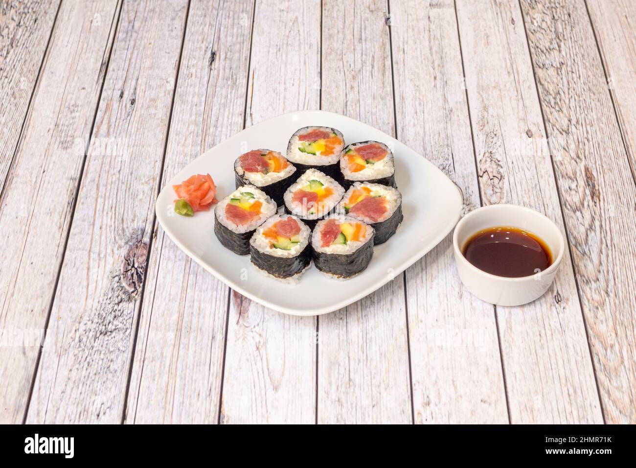 Maki sushi is therefore a roll of nori seaweed stuffed with rice and different ingredients such as fish, shellfish Stock Photo