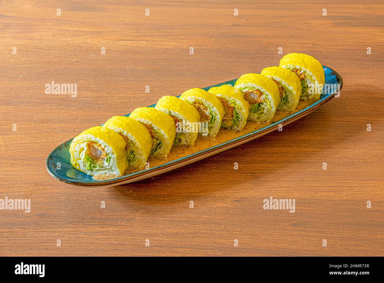 makis of vegetable slices. Sushi rolls filled with a tasty combination of quality ingredients, covered with colored vegetable slices Stock Photo