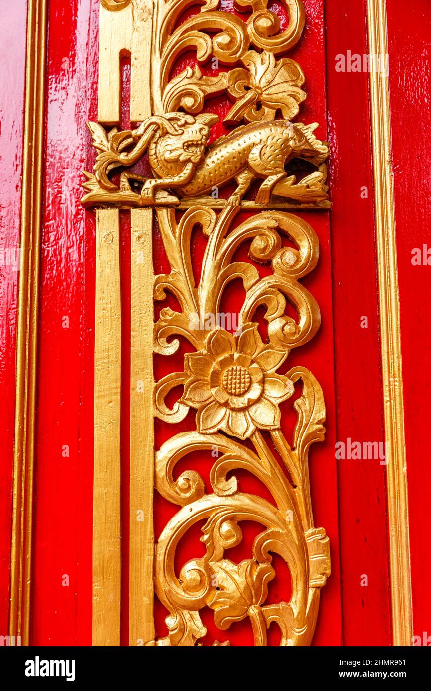 Door decoration at Chinese temple Kelenteng Ong Tay Jen Griya Kongco Dwipayana, Denpasar, Bali, Indonesia. Detail. Stock Photo