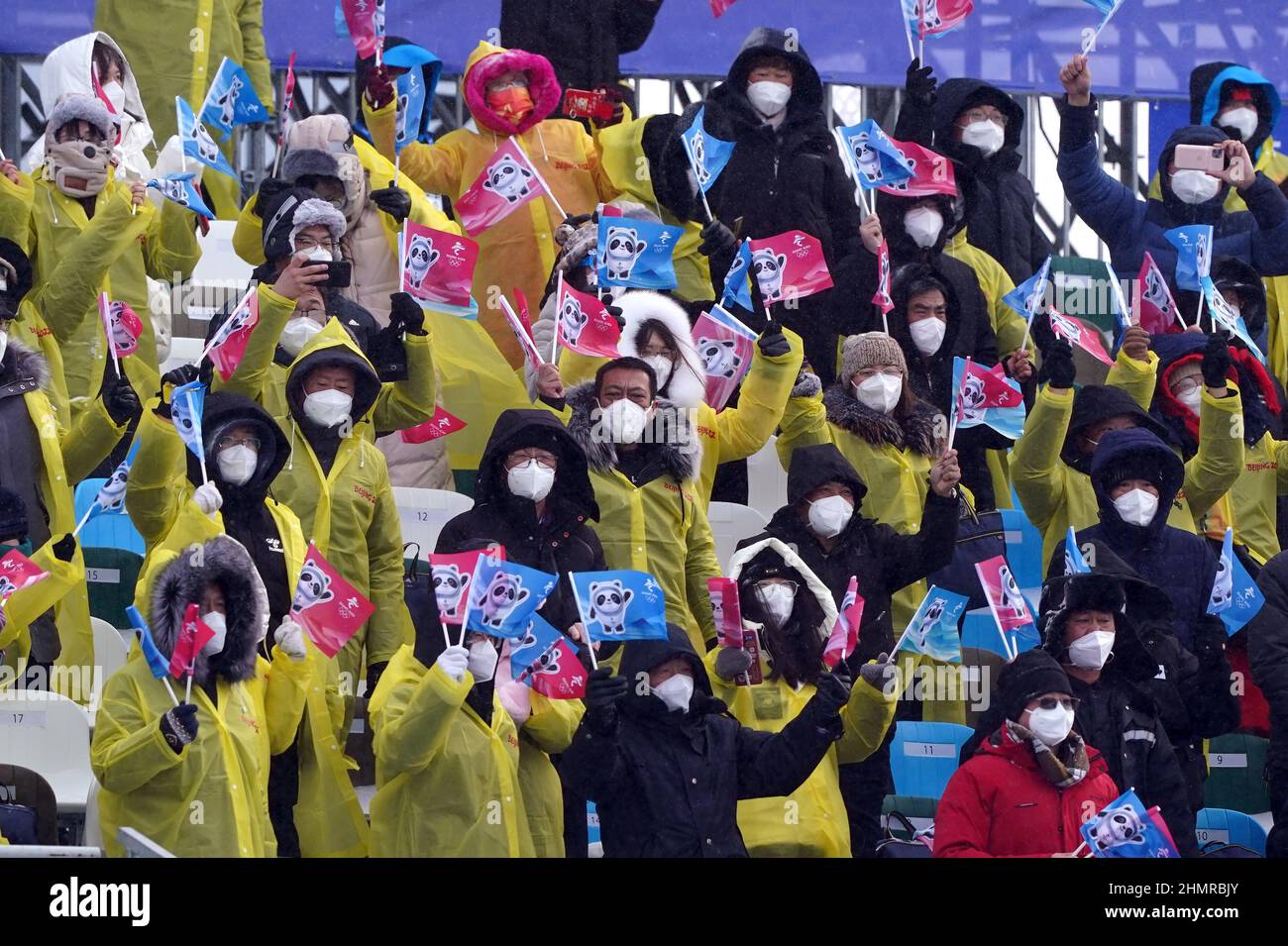 Spectators show their support for the Mixed Team Snowboard Cross finals during day eight of the Beijing 2022 Winter Olympic Games at the Genting Snow Park P & X Stadium in China. Picture date: Saturday February 12, 2022. Stock Photo