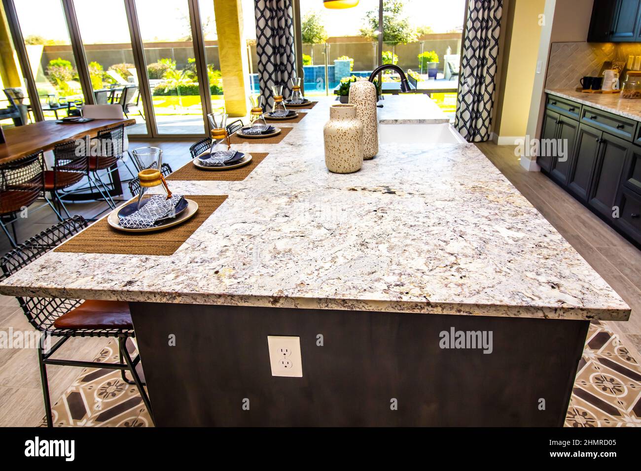 Kitchen Island Granite Counter With Five Place Settings Stock Photo