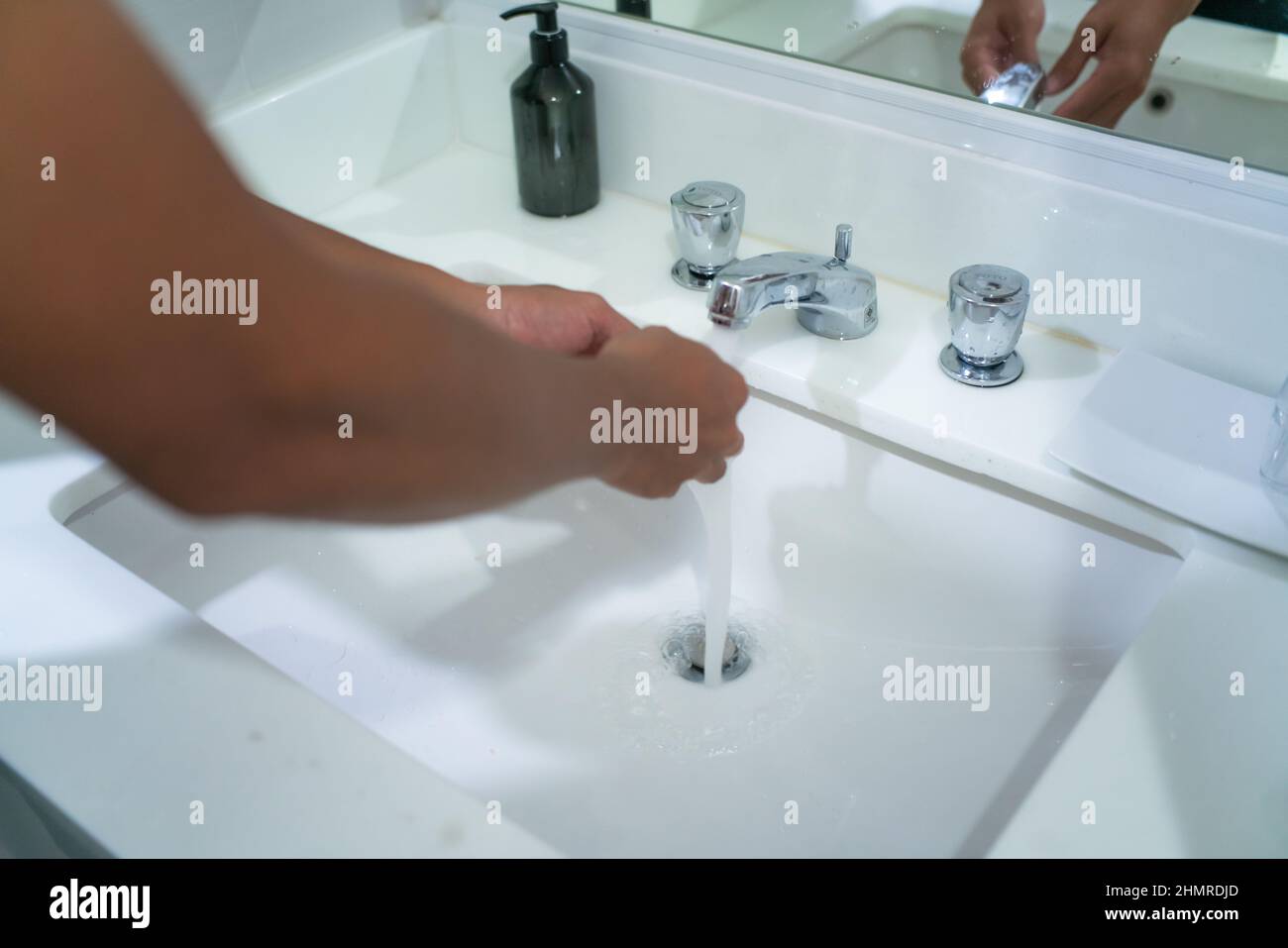 Women hand wash in hotel basin hygiene healthcare Stock Photo Alamy