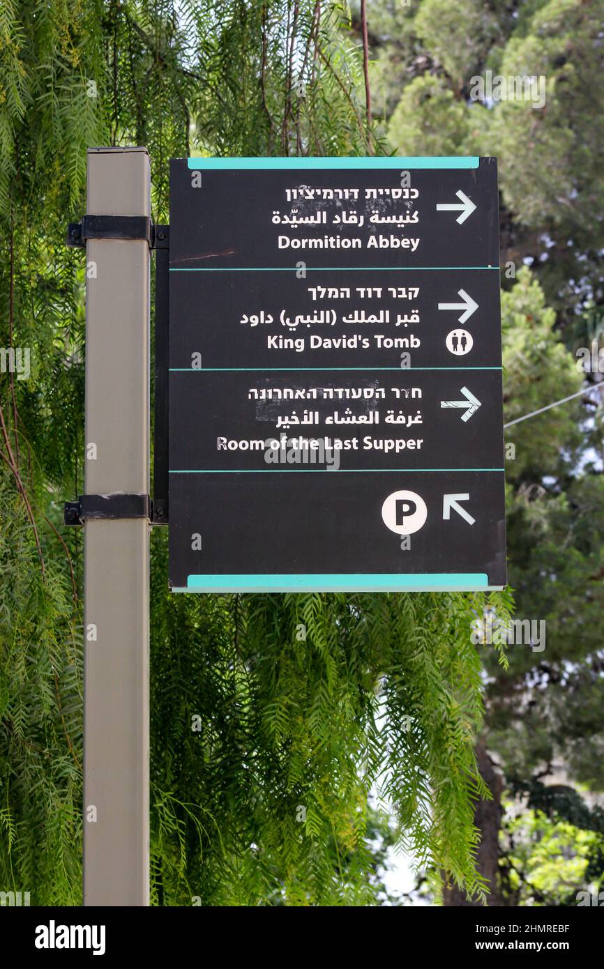 This trilingual wayfinder directs travelers to famous Jerusalem tourist sites. Stock Photo
